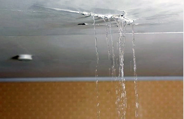 Turn the water off. Water leaking through ceiling